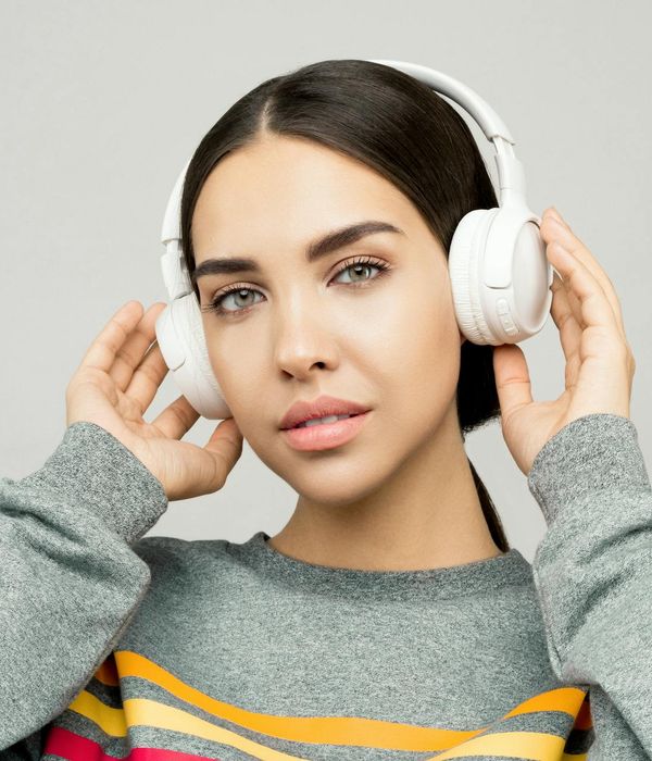 Young woman looking into the distance with peaceful expression